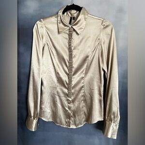 Champagne colored satin like button down blouse with unique ruffle feature. EUC